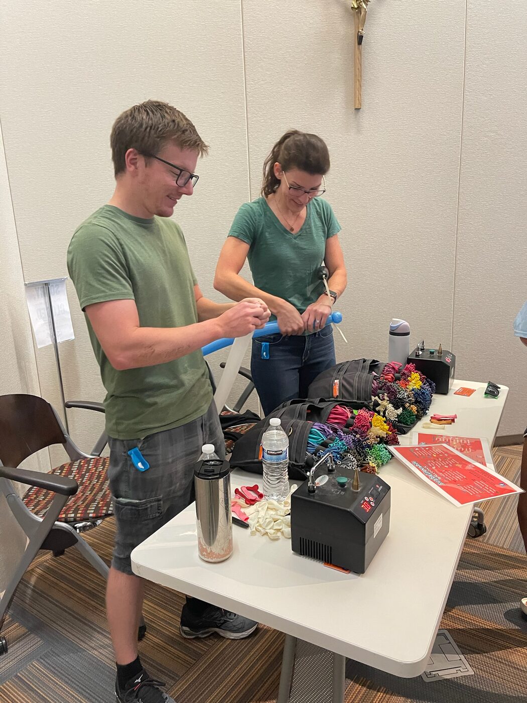 Andrew and Kathleen making balloon animals together at a live event